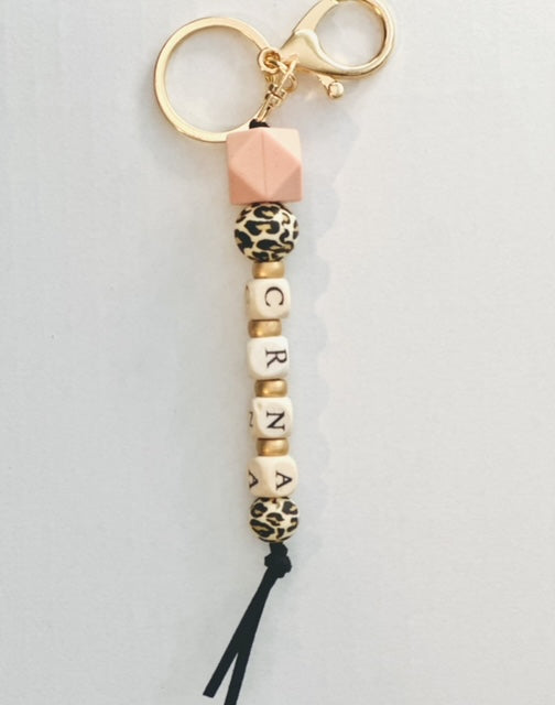 C  Wildly Stylish Keychain with Pink & Leopard Silicone beads, and custom wooden CRNA initials and gold beads